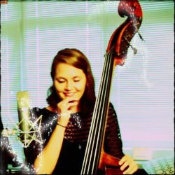Kate Davis smiling with her upright bass