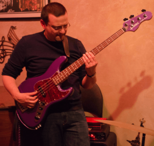 jason raso performing live on his purple spector coda bass guitar